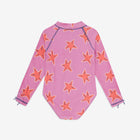 UV Protective Long Sleeve Swimsuit Pink Starfish, a pink swimsuit with a pattern of orange starfish, features long sleeves and a high neckline.